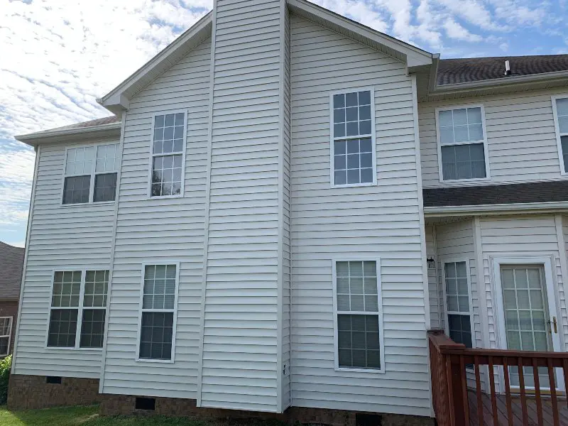 The siding of a white paneled residential property