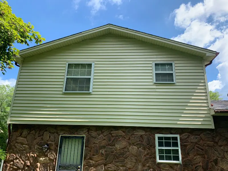 A home with different stones and siding that has been professionally cleaned