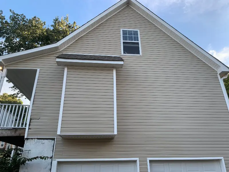 A home that has been pressure washed and has spotless panels